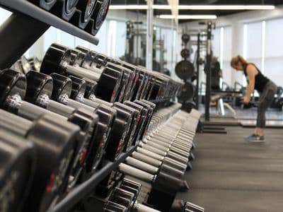 Gym members working out together in a modern fitness facility